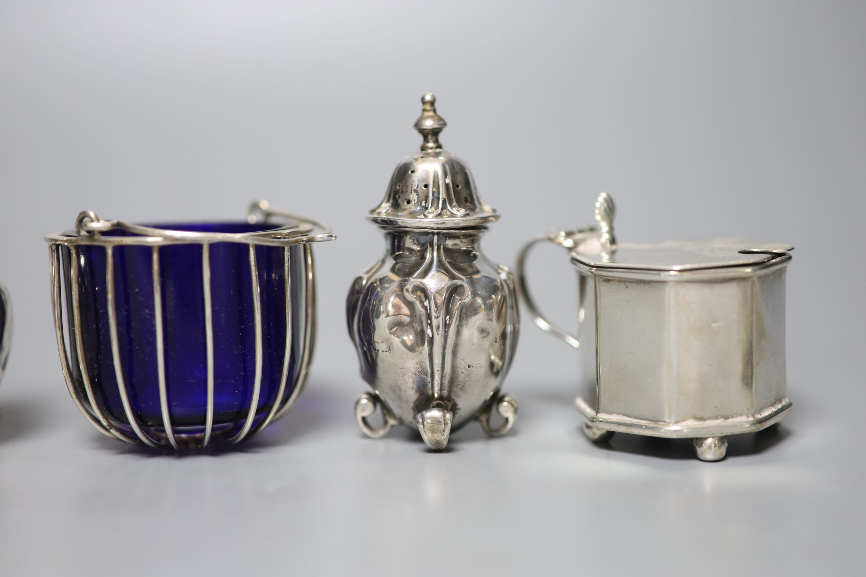Eight assorted 20th century silver condiments including two mustard pots.